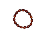 Amber stone beaded bracelet on a white background