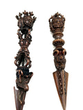 carved head close up of phurba for cutting energy 