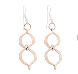 A pair of copper drop earrings featuring serpentine circle designs.