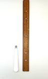 Wooden ruler next to a crystal