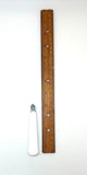 Wooden ruler and crystalon a white background