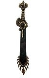 A decorative metal spiritual tool with a black handle and gold-colored metal parts, featuring intricate designs and a pointed end.