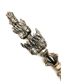 intricately carved silver phurba with Quan Yin head dorje