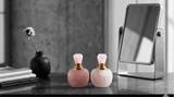 Rose quartz perfume bottle on vanity